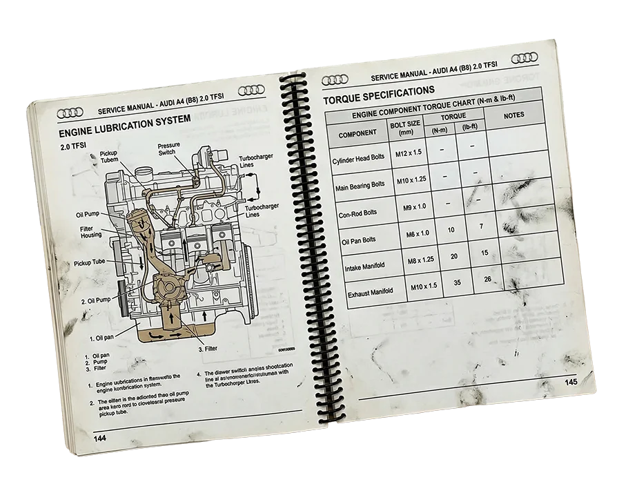 Factory service manual open to a wiring diagram and specification table